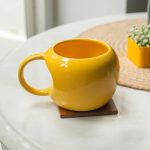 10Club Ceramic Mug – 320 ML Yellow Curved Cup for Home & Office, Ideal for Soup, Coffee, and Tea – Microwave & Dishwasher Safe, Perfect Gifting Option, 1pc